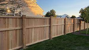 Master the Art of Elegant Boundary-Making: How to Get a Perfect Wood Fence Installed